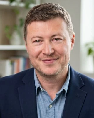 Markus Pantea seated in his counselling office